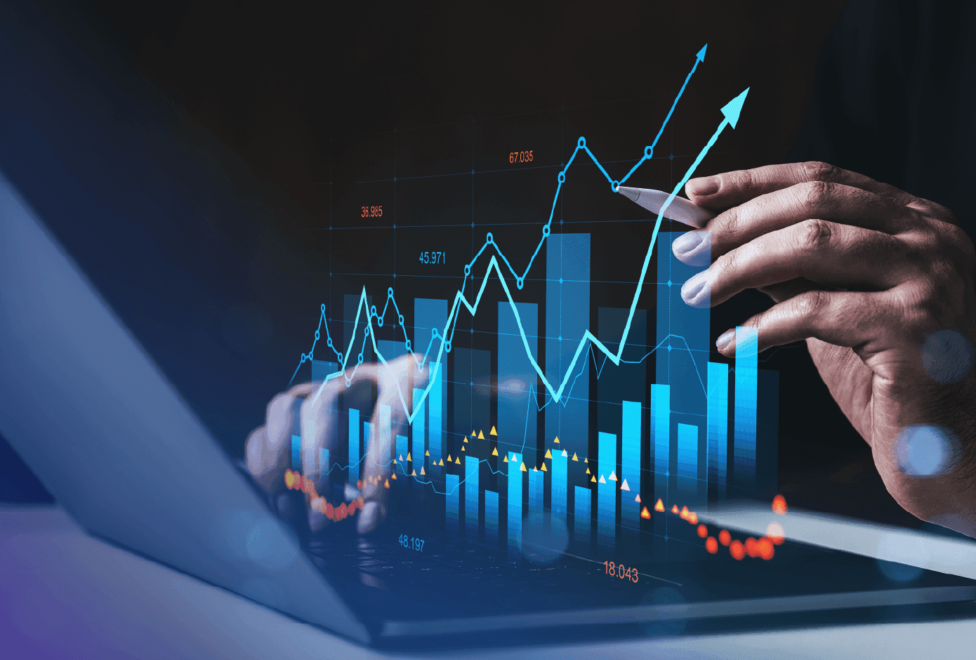 Person using a laptop with holographic financial charts and trend lines rising, representing data-driven fraud trend analysis