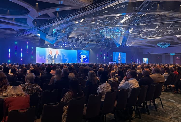 A view of the stage behind a crowd at VeleraLVE 2026.